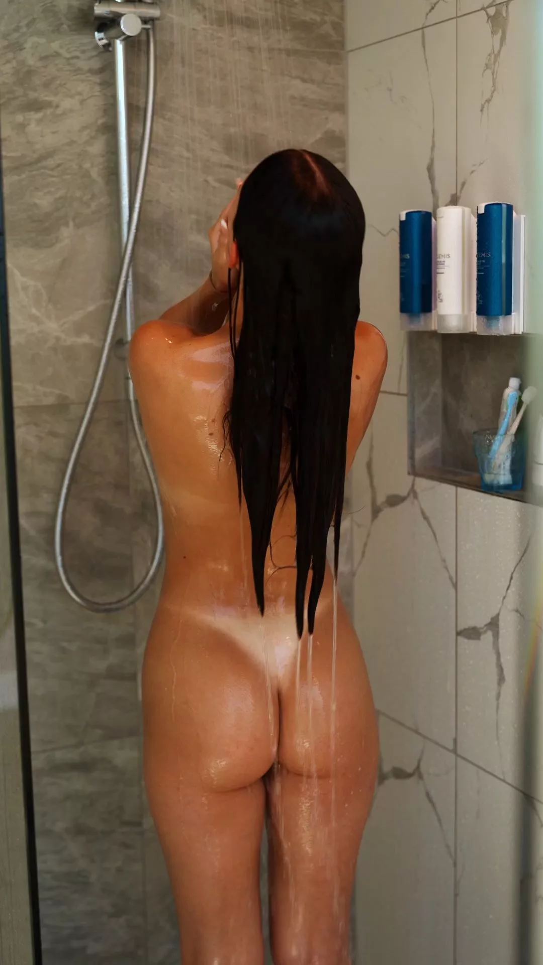 petite tanned body showering